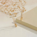 SUSHEE Anti Tarnish Gold Plated Safety Pin Shaped AD Studded Drop Earrings for Women
